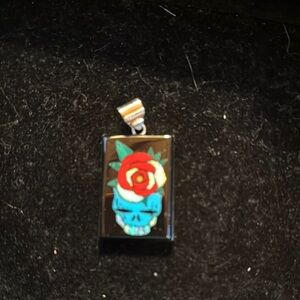 Skull Pendant with Red Rose Design